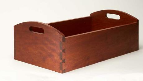A cherry serving tray with hand-cut dovetail joinery