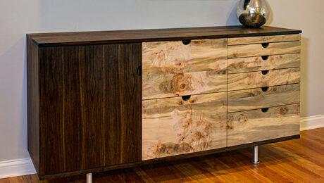 A contemporary take on a midcentury modern sideboard used as a bar.