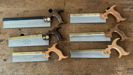 Clockwise from top right: Lie-Nielsen non-tapered dovetail saw. Lie-Nielsen tapered dovetail saw; Eccentric Toolworks dovetail saw (no longer made); Lie-Nielsen non-tapered progressive-pitch dovetail saw (no longer made); Bad Axe 10" tapered dovetail saw; Bad Axe 12" non-tapered dovetail saw.