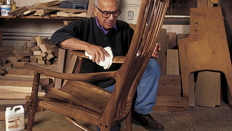 Sam Maloof polishes a chair