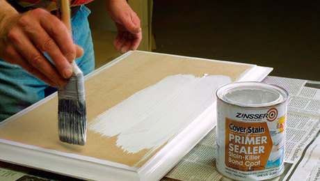 Painting an MDF cabinet face white.